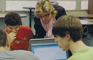 Debbie Pritchett assists students in calculus class. 